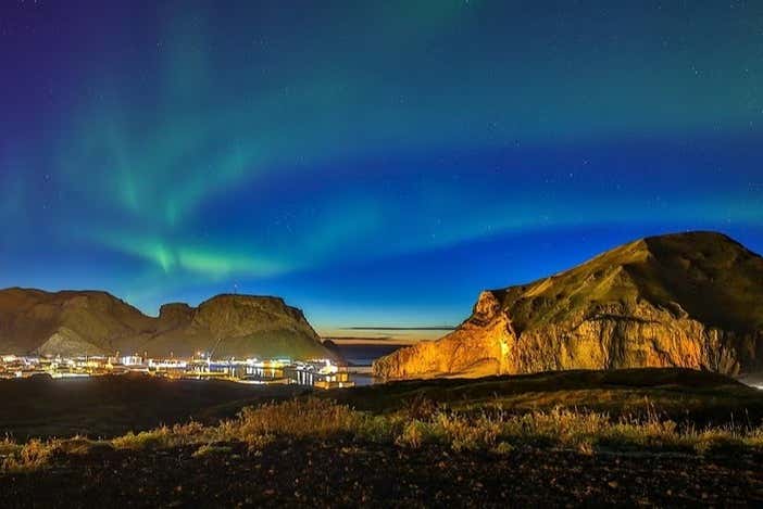 Witness the magical beauty of the sunset off the Vestman Islands
