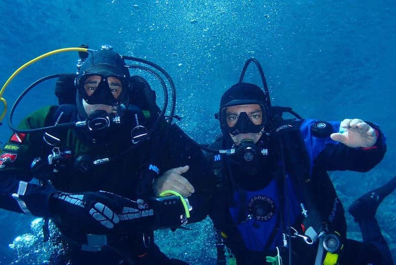 Enjoy scuba diving in Aci Castello