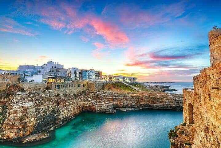 Be captivated by Polignano a Mare, perched atop a cliff