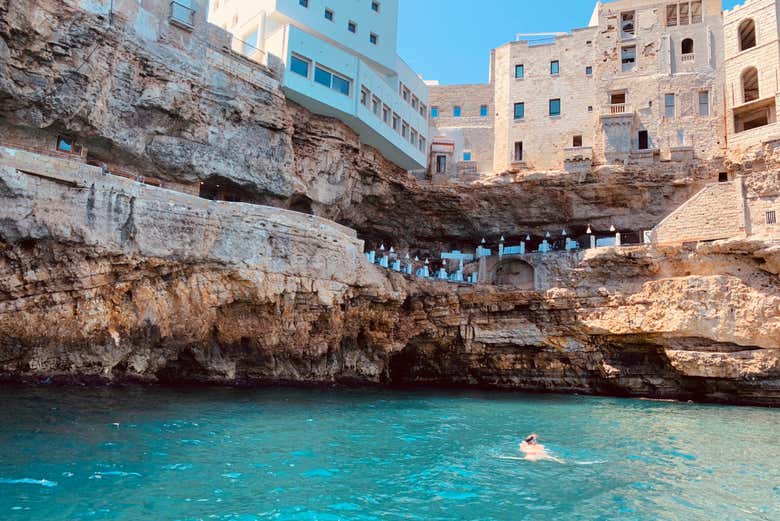 Sail on crystal-clear waters among cliffs and caves