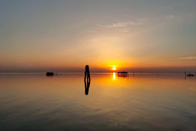 Watch the sun set over the water
