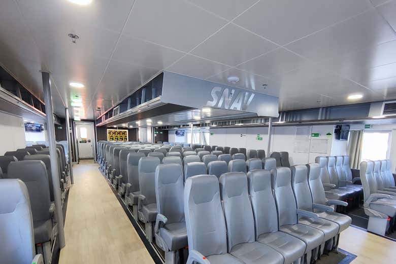 The modern, air-conditioned interior of a SNAV fast ferry.