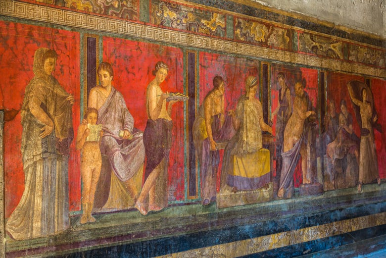 Admiring the incredible murals in Pompeii