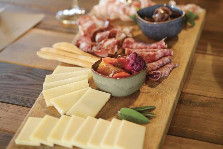 Enjoy a board of cheeses and cured meats