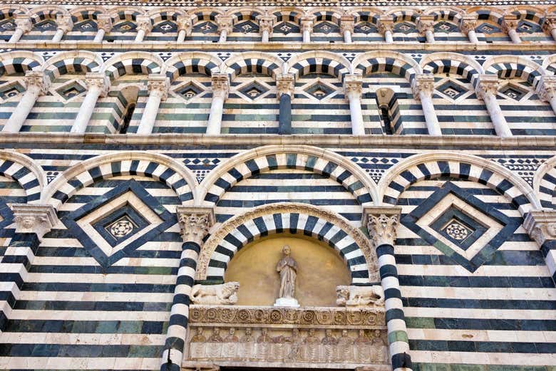 Admire Pistoia's distinctive zebra-striped facades