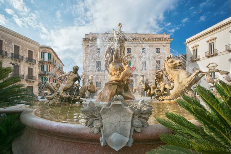 Standing by the fountain in Piazza Archimede, Ortigia