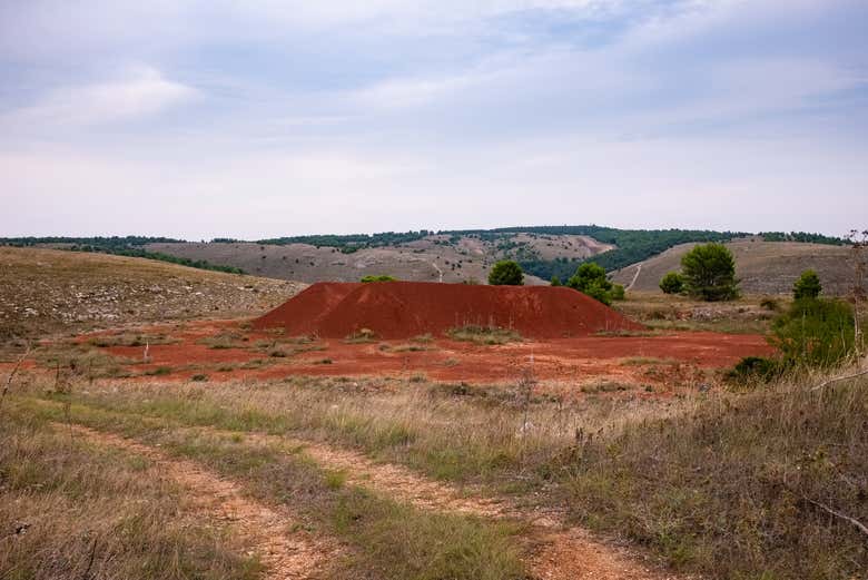The reddish color of the bauxite mines