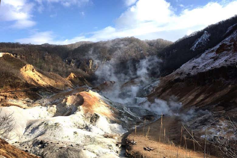 Admire the hot springs and volcanic landscapes