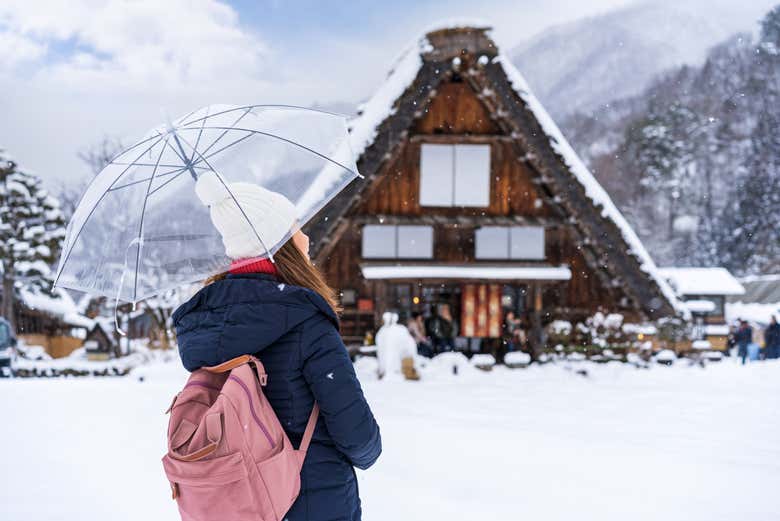 Wander through Shirakawago's snow-covered streets