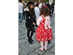 Many girls take their stuffed animals for a walk