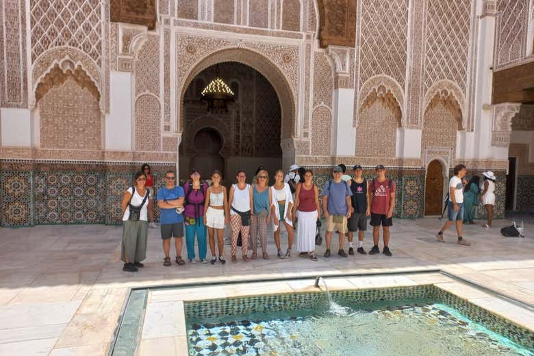Admire the intricate architecture of the Ben Youssef Madrasa