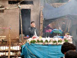 Aghbalou, merchant at the traditional market