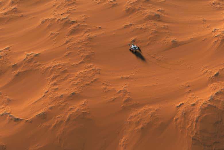 Vistas aéreas de un rover explorando la superficie de Marte