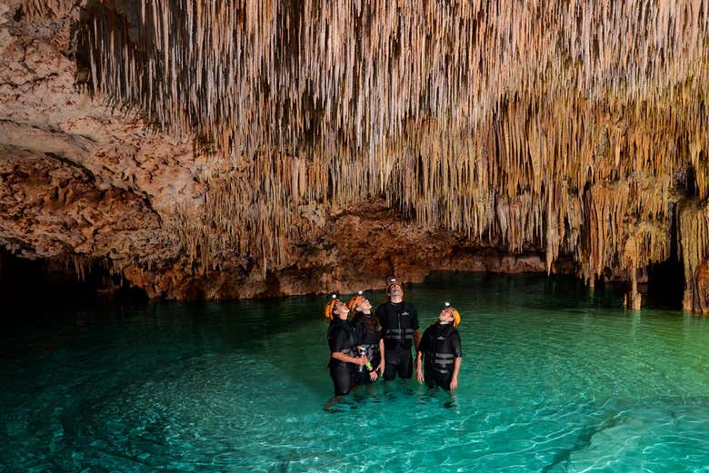 Exploring a cave in the Rio Secreto