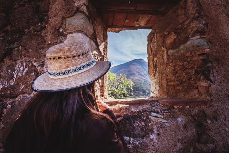 Admire the landscape through a stone window!