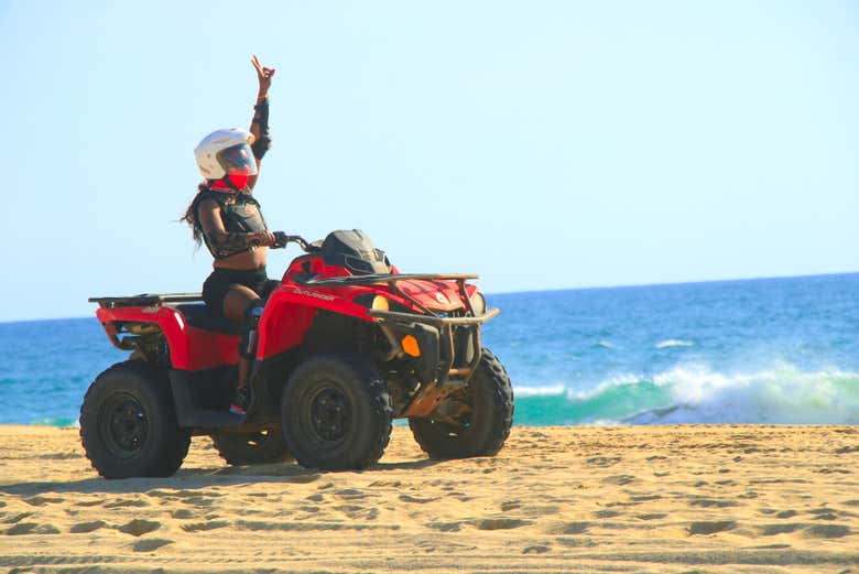 Zipping around the beach on a quad