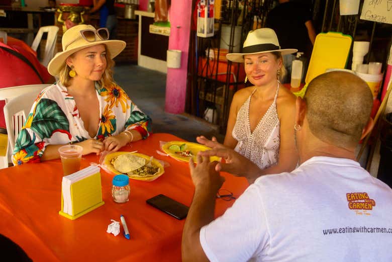 Eat tacos, sopes, and cochinita pibil