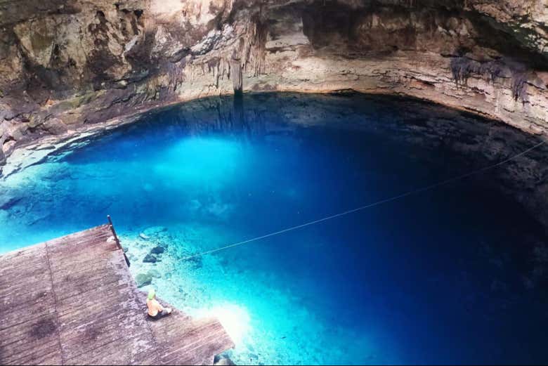 Take a dip in the stunning waters of the cenote