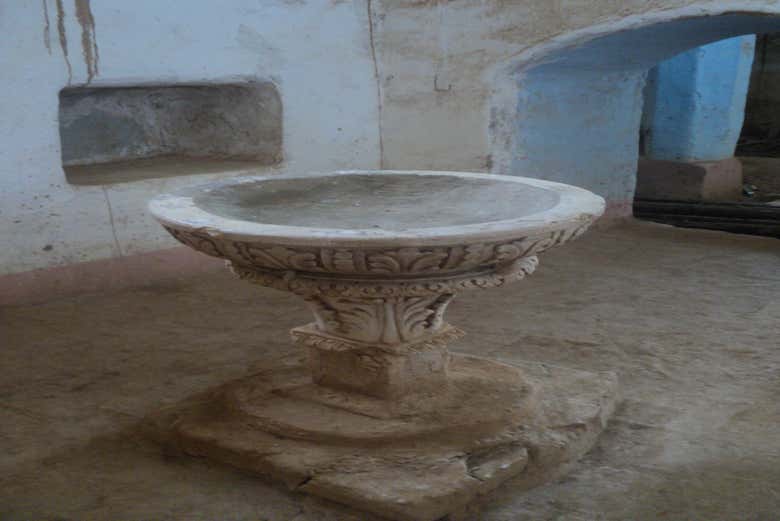 The carved baptismal font