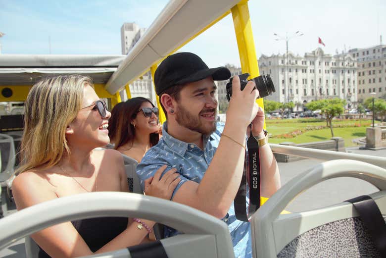 The guide assisting passengers