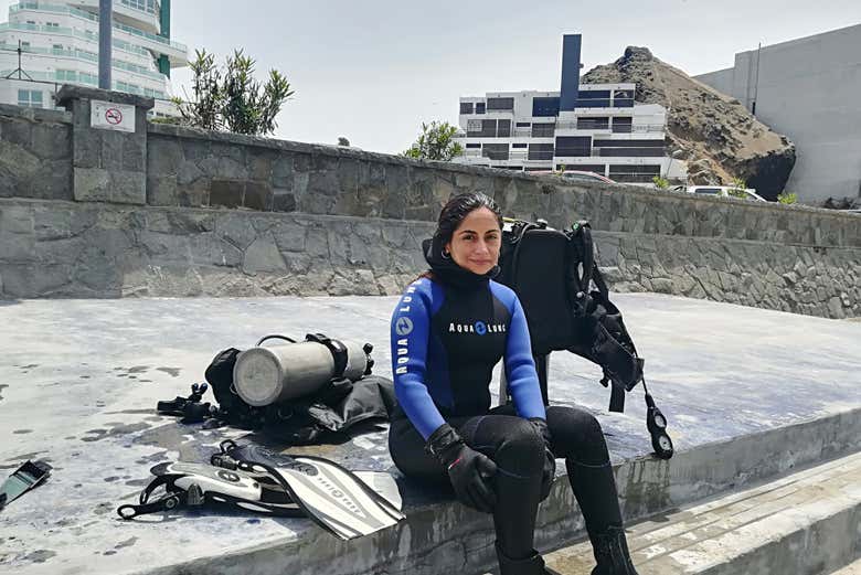 Putting on the neoprene wetsuits