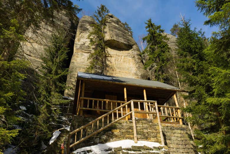 A Cabin nestled among the cliffs and woods