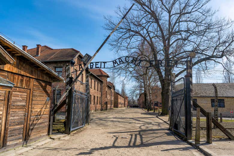 Capture the solemn entrance of Auschwitz-Birkenau