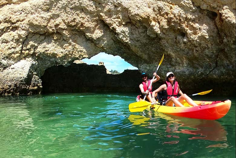 Sail under arches and around rock formations