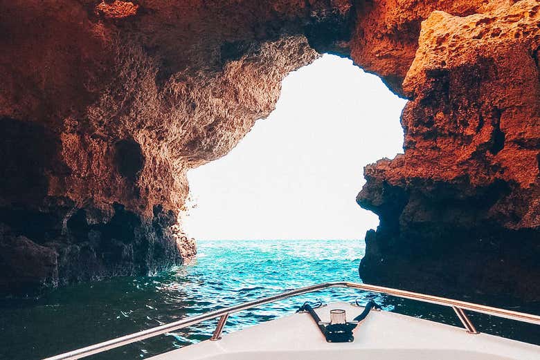 A boat leaving the cave