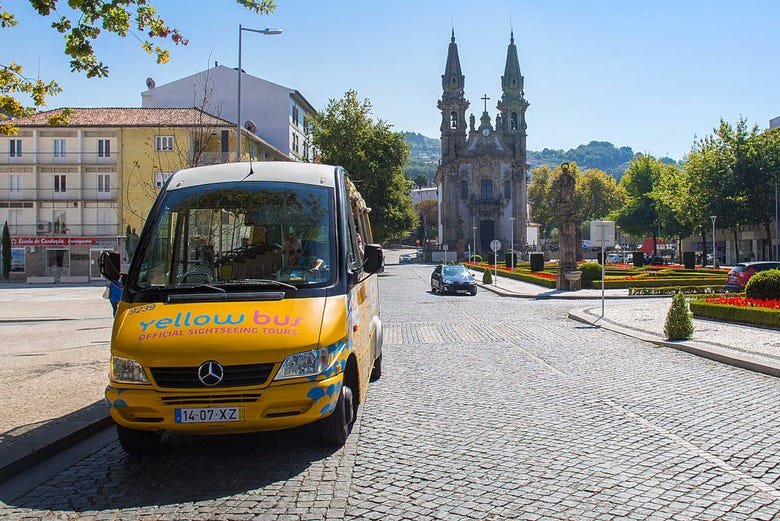 The sightseeing bus next to a historic church