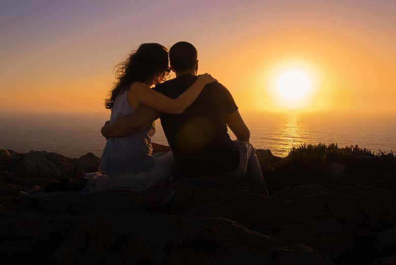 Romantic moment admiring the sunset view