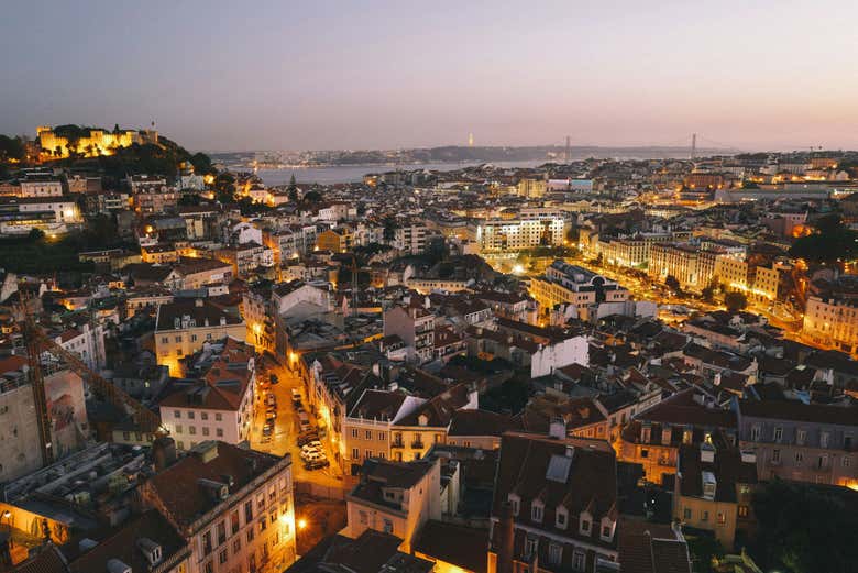 Take in the views of the glittering lights of Lisbon