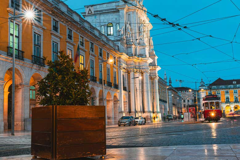 Stroll through Lisbon's grand squares as the city glows at dusk