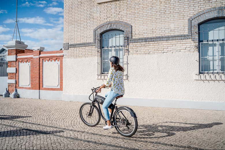 Cycle along cobbled streets