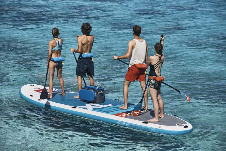 Friends having fun paddleboarding