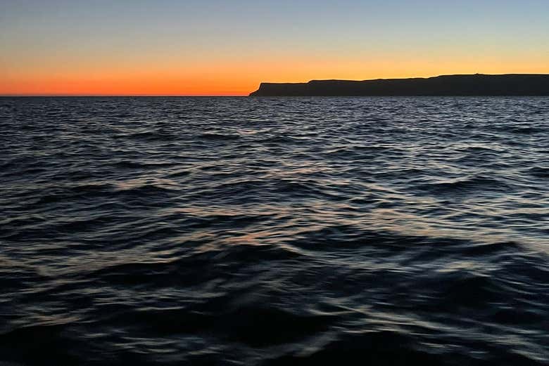 Enjoy a sunset while sailing along Cape Espichel