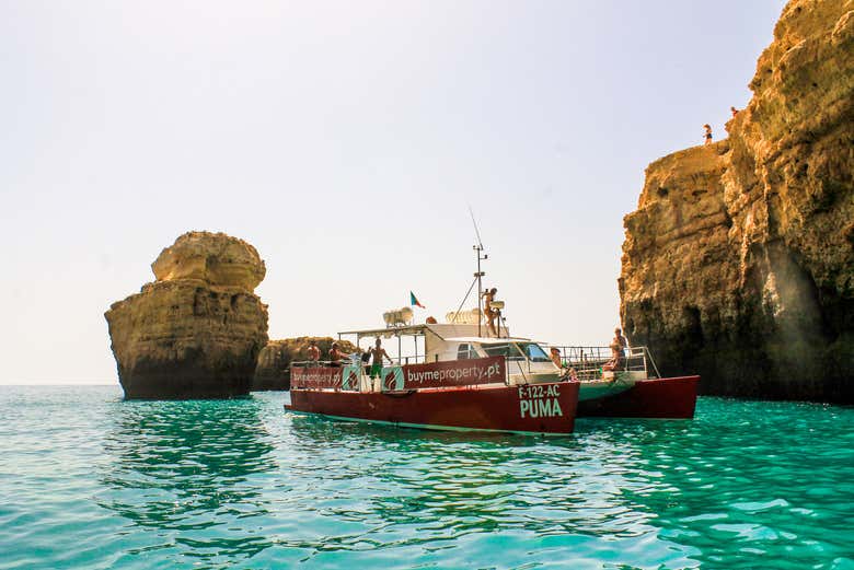 Sail along the Algarve coast at sunset