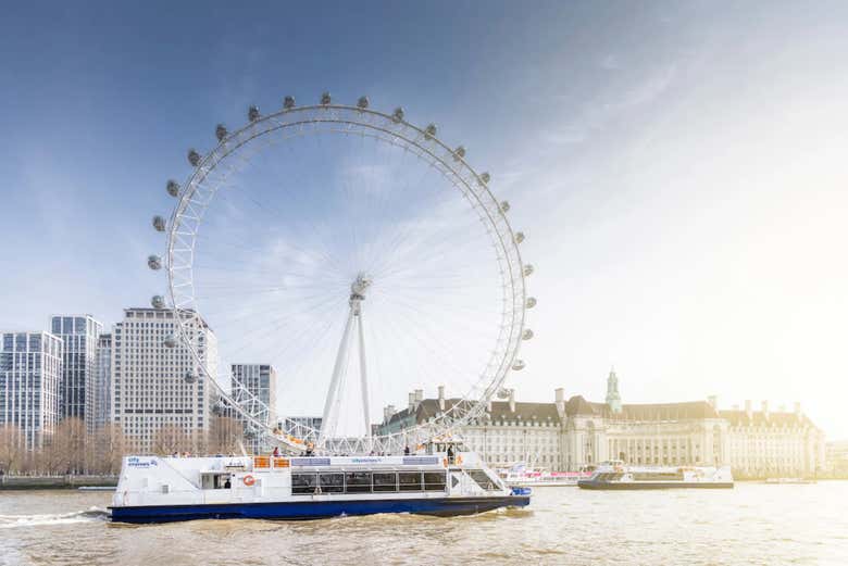 The boat passing the London Eye