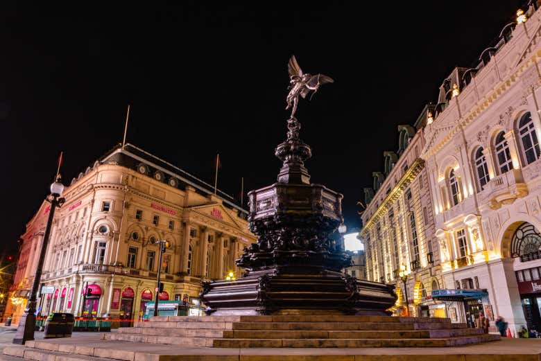 Eros statue at night