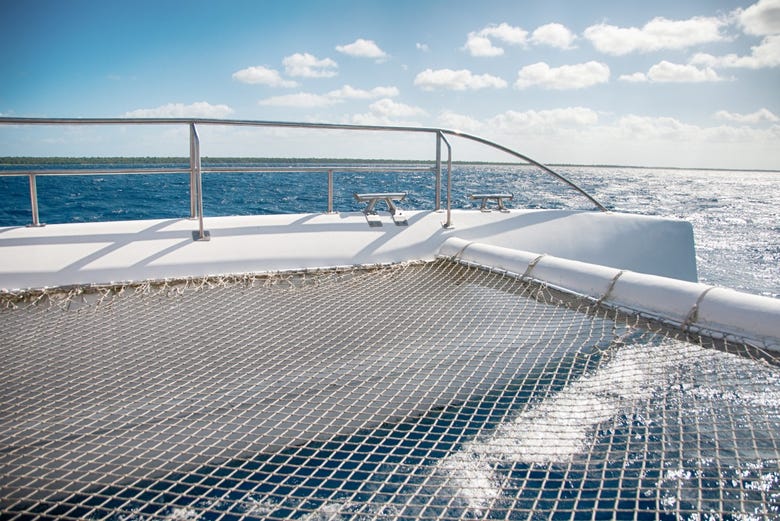 Sunbathe on board the catamaran