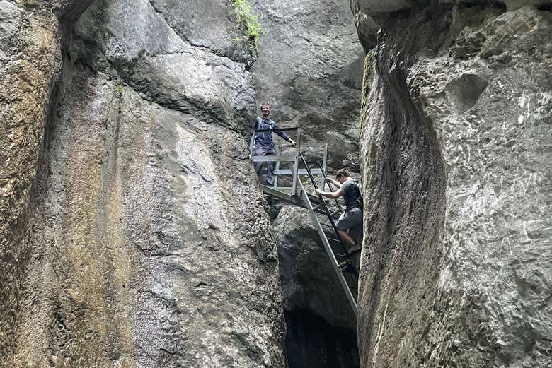 Climbing the rocks of Seven Ladders Canyon