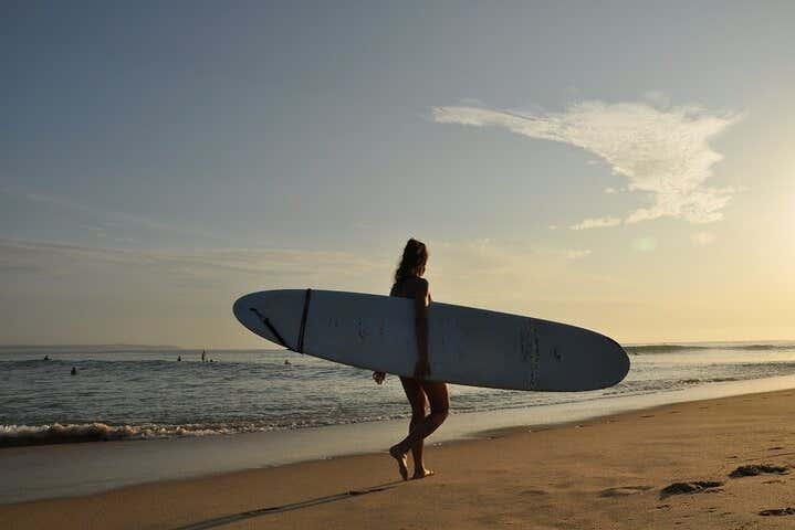 Learn how to surf on a paradisiacal beach