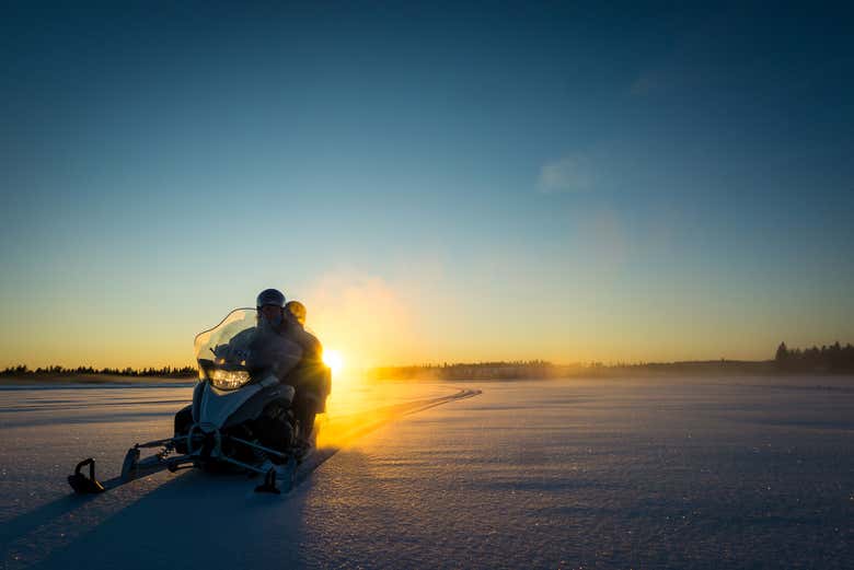 Driving the snowmobile across the snow