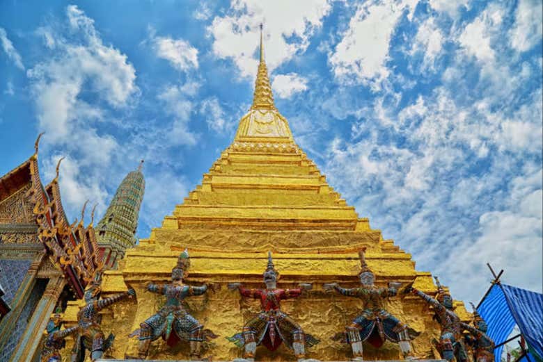 Admire the intricate details of the palace's golden spires