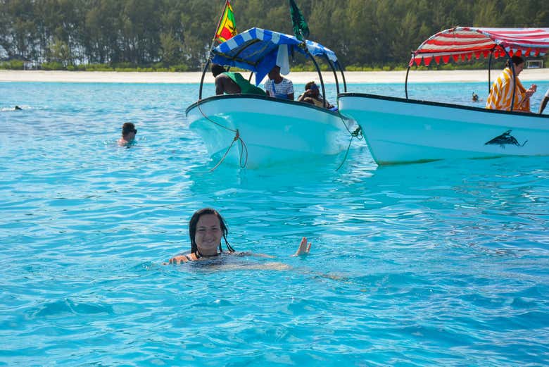 Swim among coral reef
