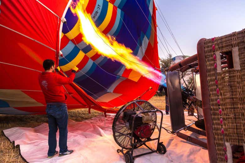 Preparing the hot air balloon for takeoff